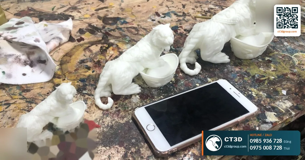 White 3D printed figurine samples made from a new design – prototype check before production