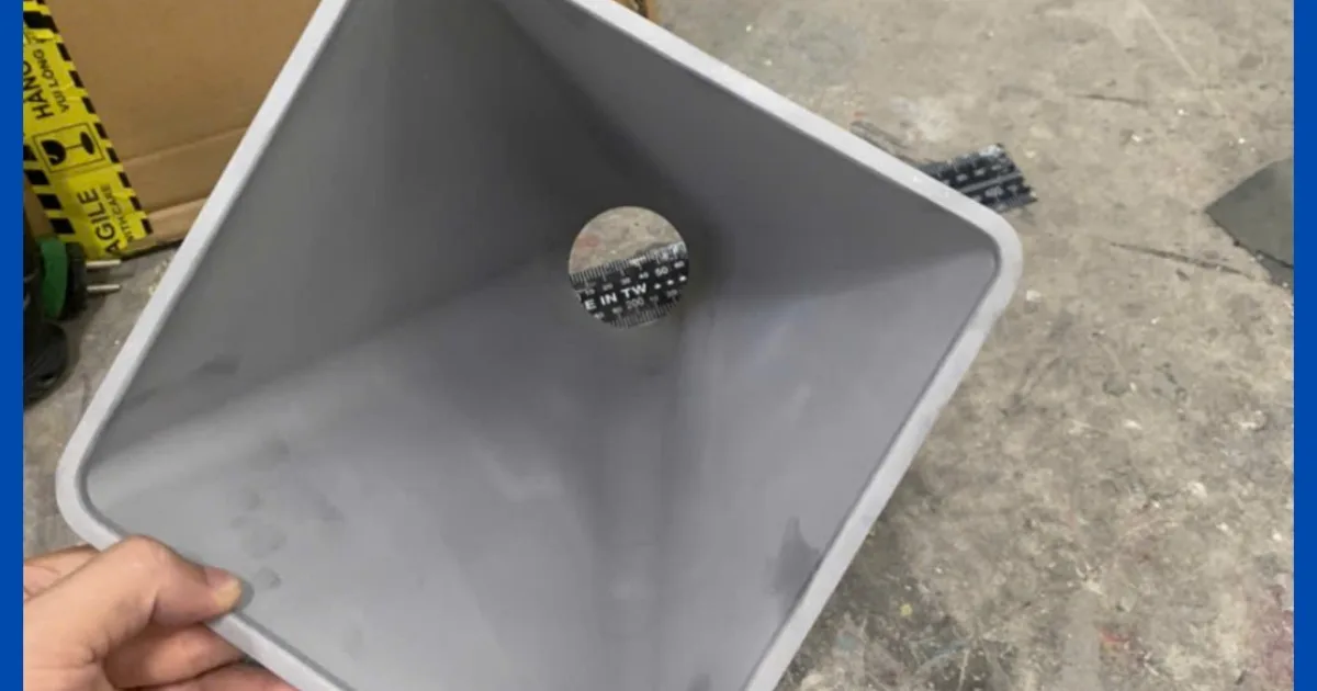 Metal 3D printed square funnel part from a client project, shown in the CT3D workshop