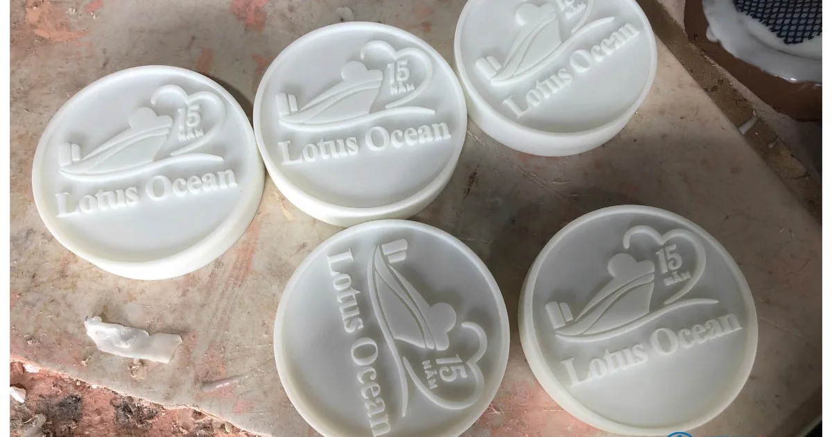 SLA-printed master patterns with relief logo, prepared for silicone mold making – CT3D