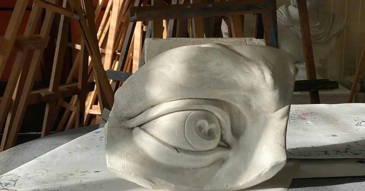 Carved stone eye sculpture in an artist studio – illustrative stone carving photo